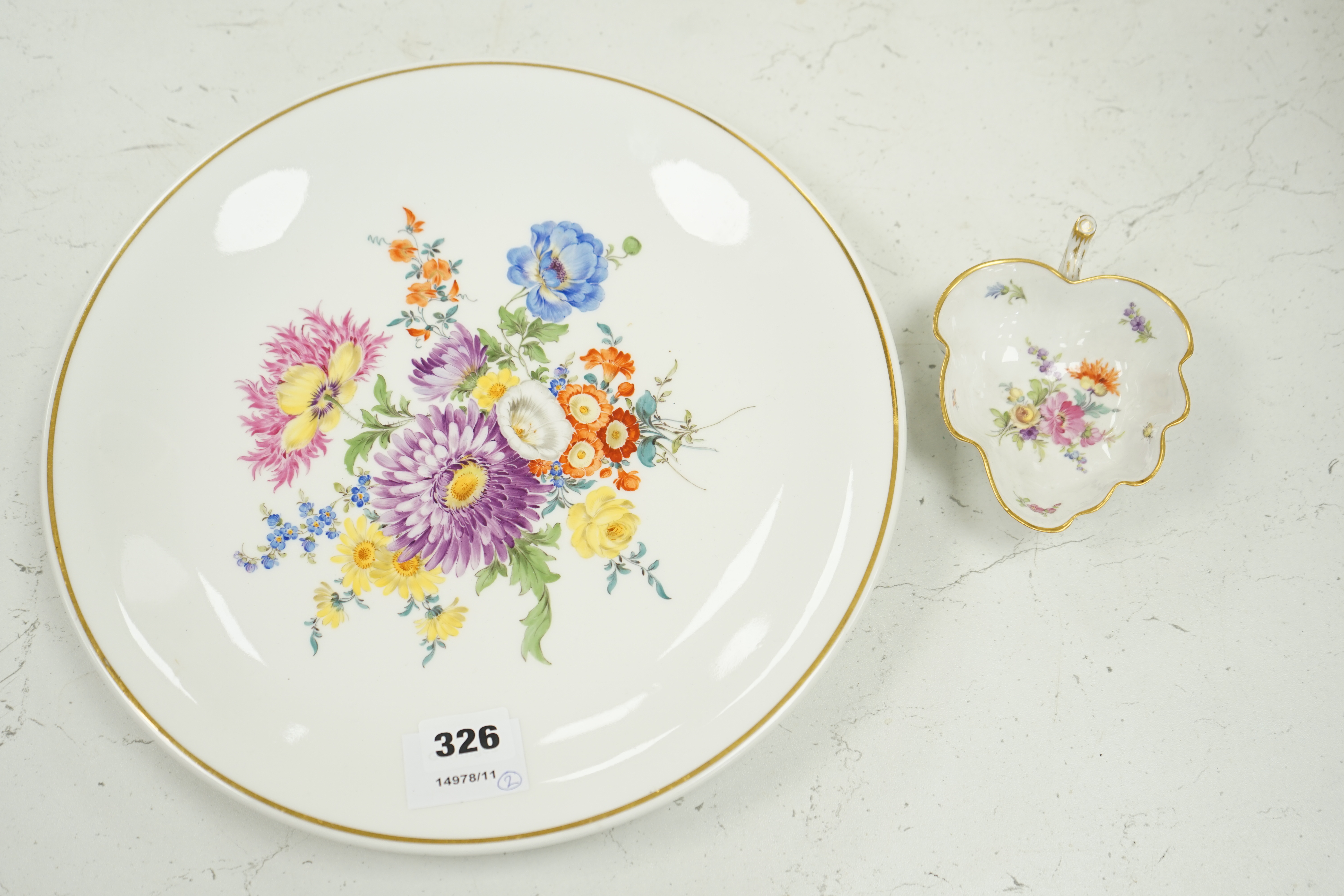 A 20th century Meissen floral painted dish and a similar leaf pickle dish, 31cm in diameter. Condition - good